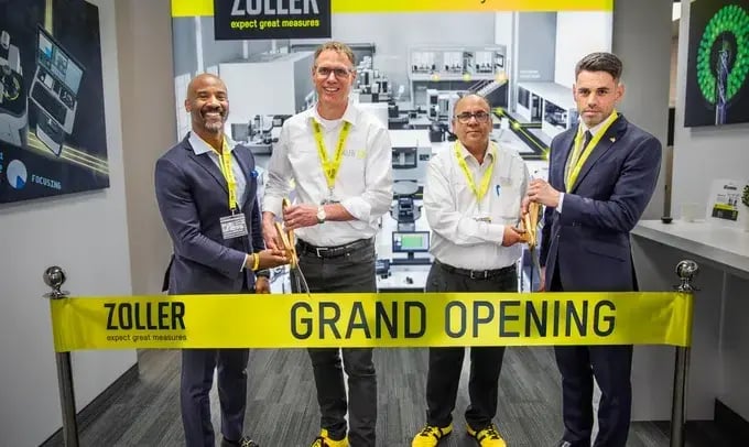 group cutting ribbon at ZOLLER Canada