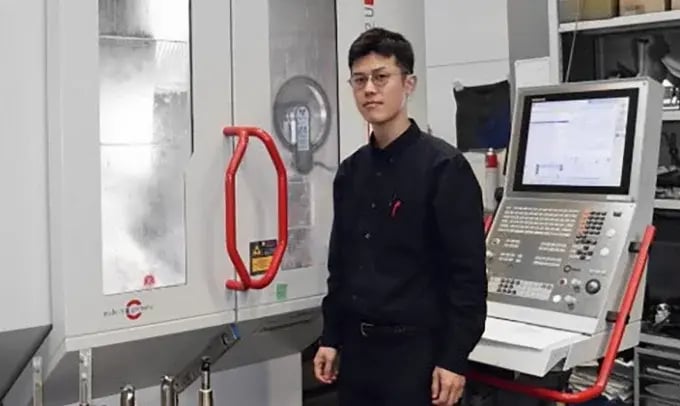 CEO Mr. Nukiguchi in front of machine