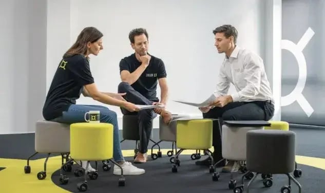Attend on-site events three people talking at ZOLLER smart factory